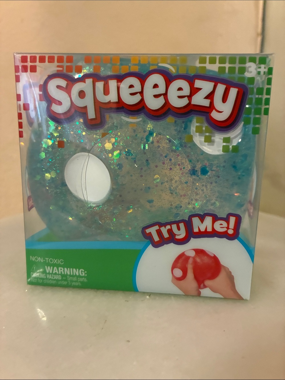Squeeezy Glitter Dice Sensory Ball - Clear Blue